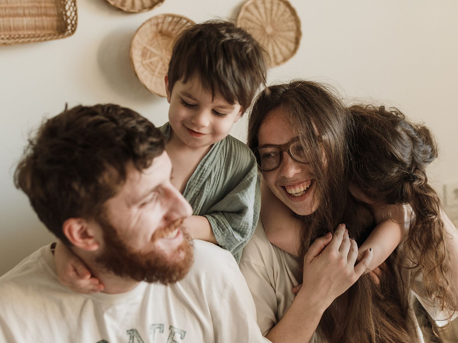 A parent and their children at home